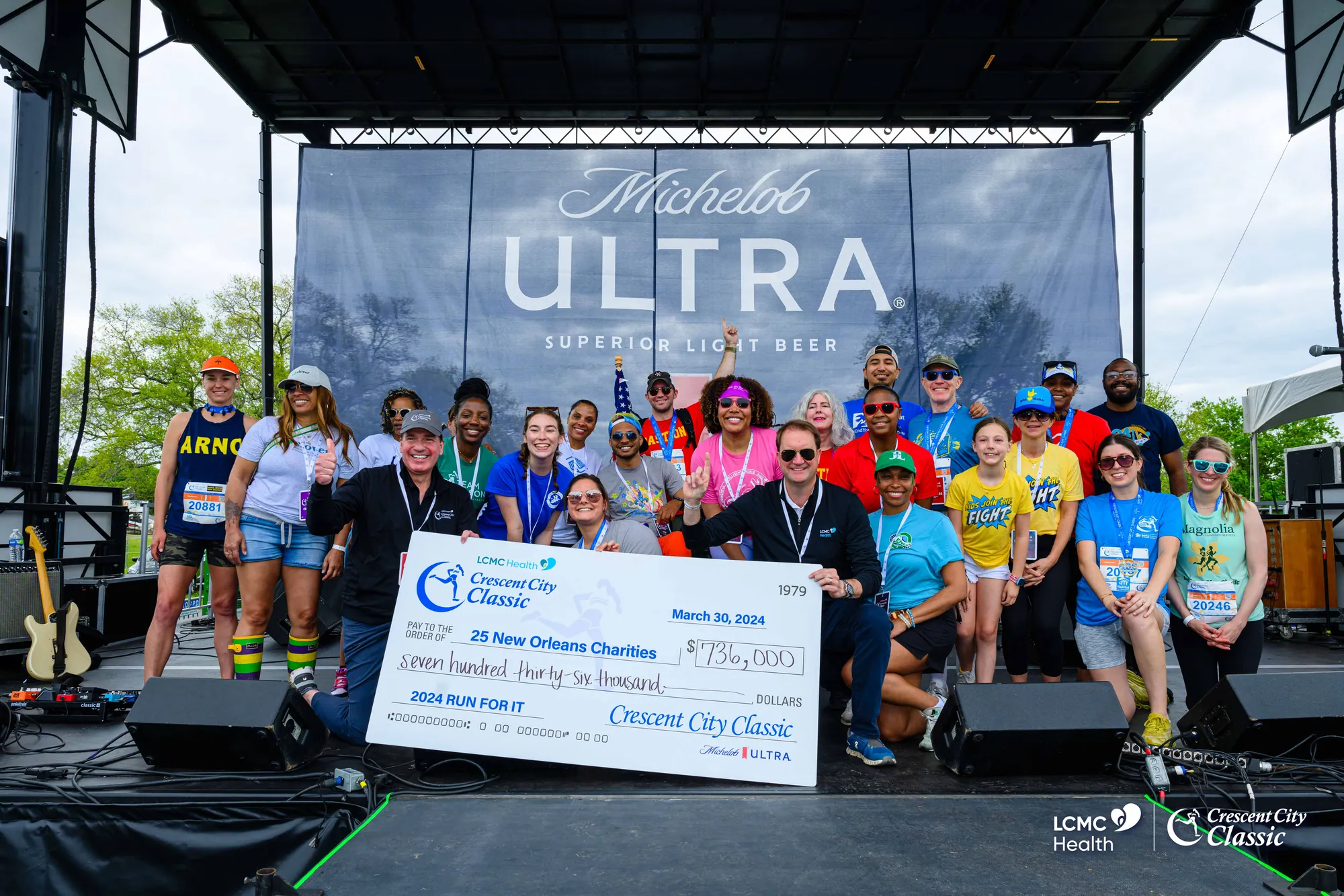 The Run for It check presentation on the RaceFest stage